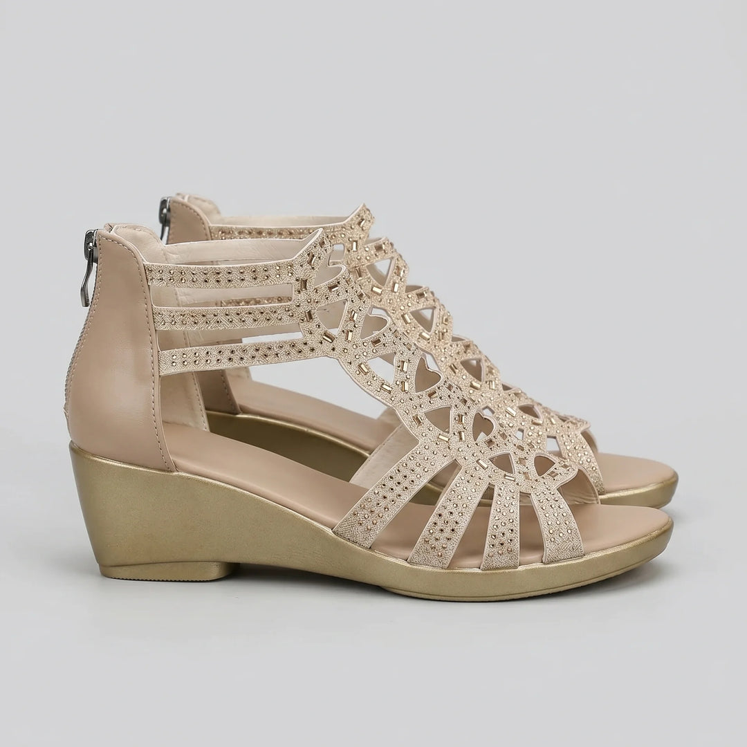 Beige wedge sandal with lace-up design on a light gray background