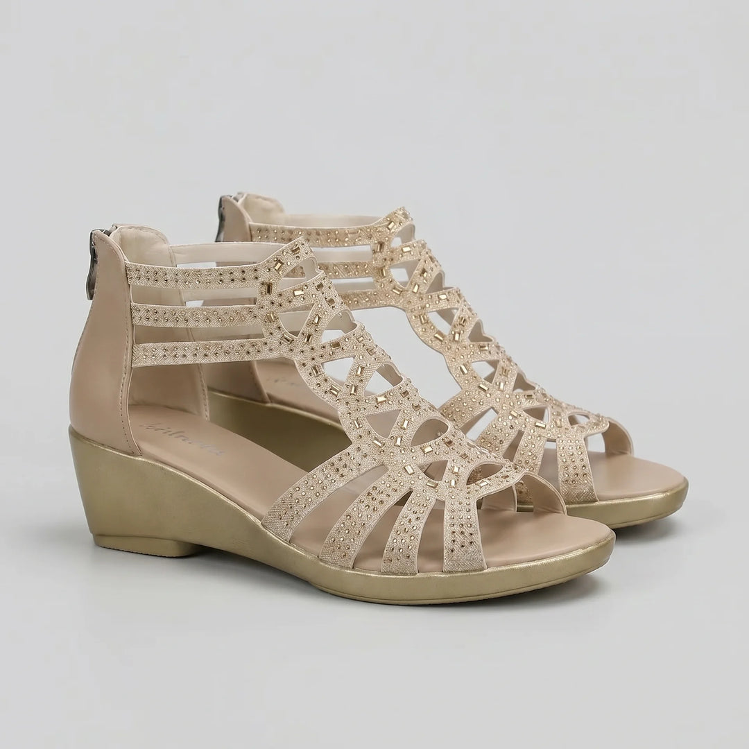 Beige wedge sandals with open design on a light gray background