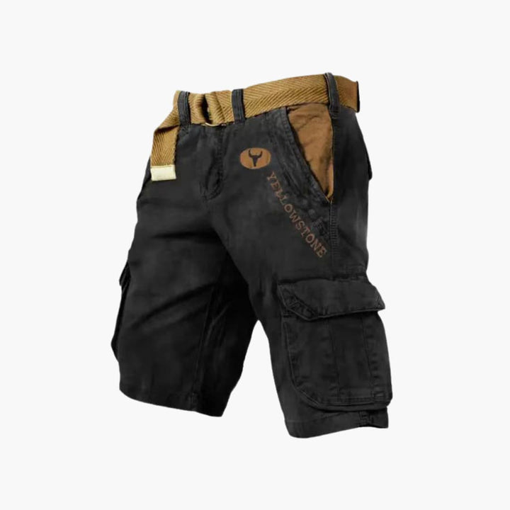 Black knee-length cargo shorts with tan contrast pockets, Yellowstone branding, and a matching utility belt.