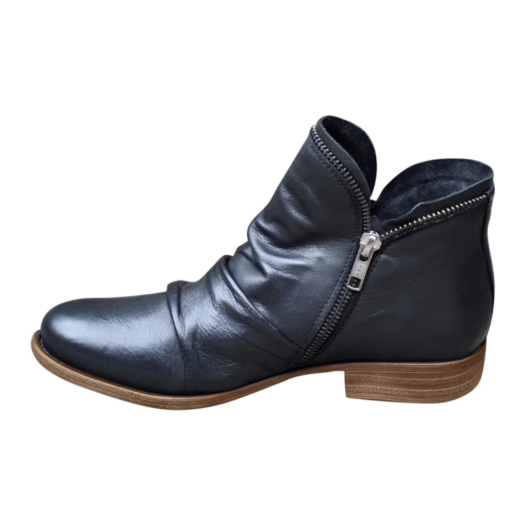 Black leather Tilly ankle boots featuring a soft ruched upper, side zip closure, and a comfortable low block heel.