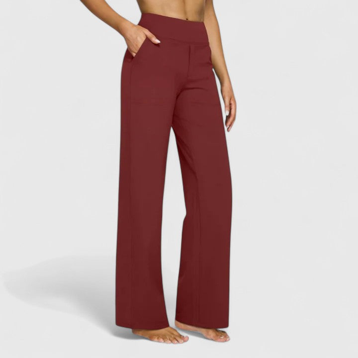 Vivienne women's pull-on wide waistband trousers in a rich burgundy, featuring deep side pockets and a relaxed fit.