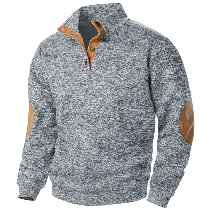 Grey marled knit sweater with a quarter-button placket, stand-up collar, and tan suede-style elbow patches.