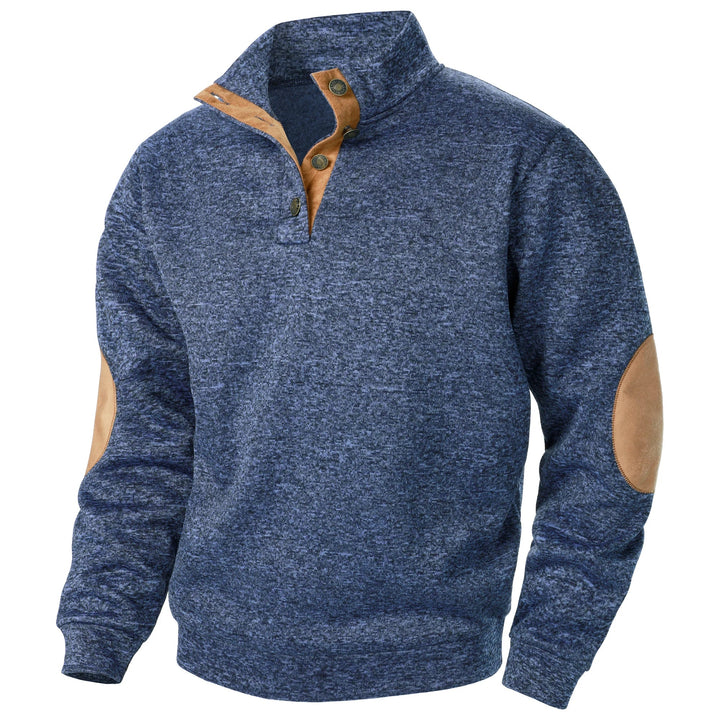 Blue marled knit quarter-button sweater with tan suede-style collar trim and elbow patches.