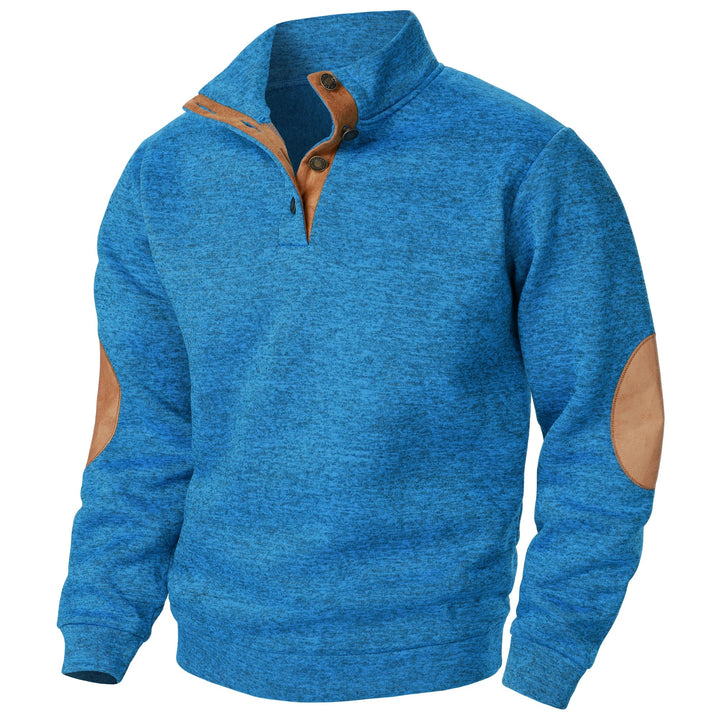 Blue marled knit quarter-button sweater with tan suede-style collar trim and elbow patches.