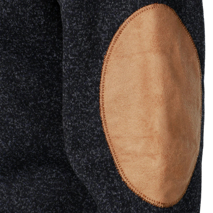 Close-up of a dark charcoal marled knit sweater featuring a tan suede-style elbow patch with contrast stitching.