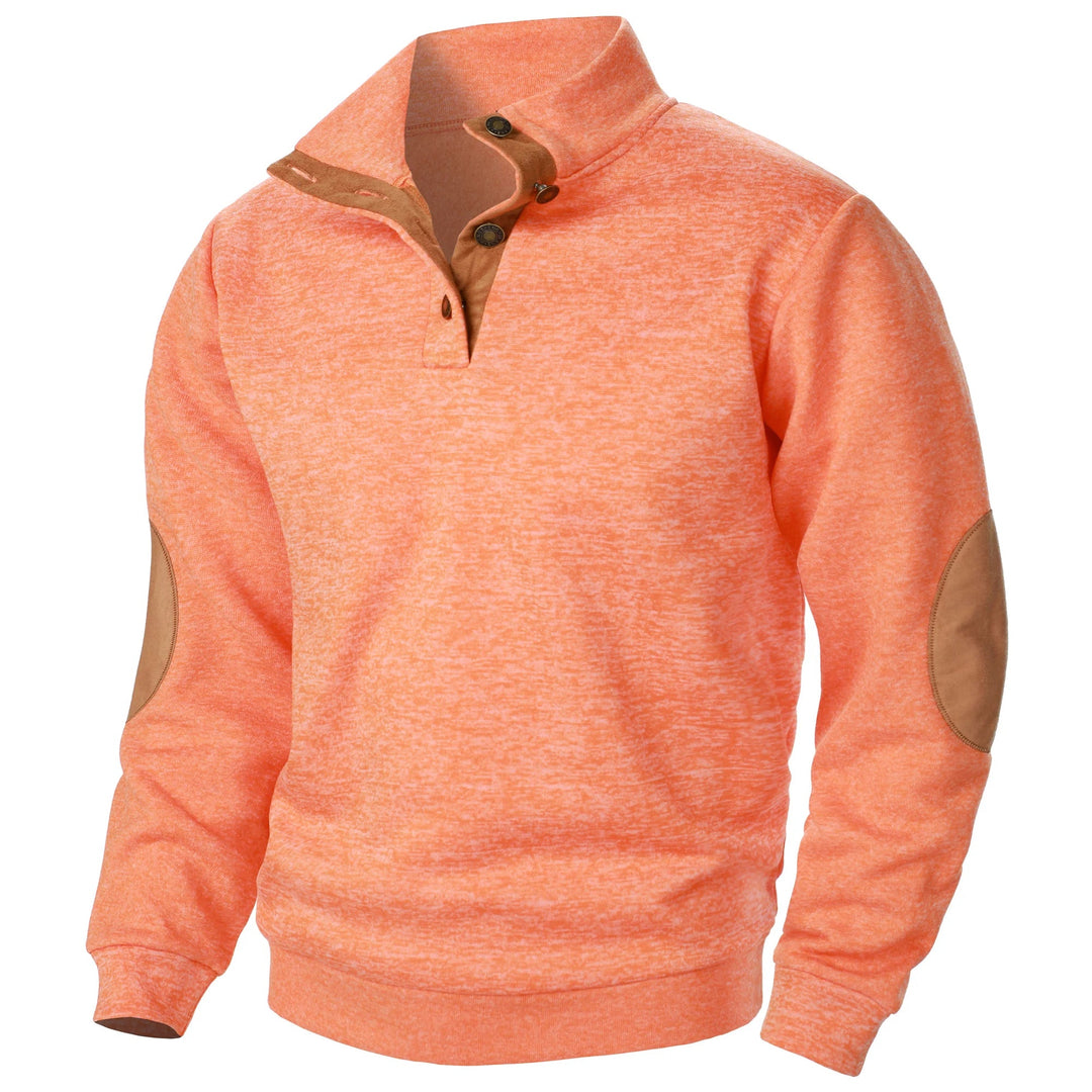 Orange marled knit quarter-button sweater with a stand-up collar, brown suede-style trim, and matching elbow patches.